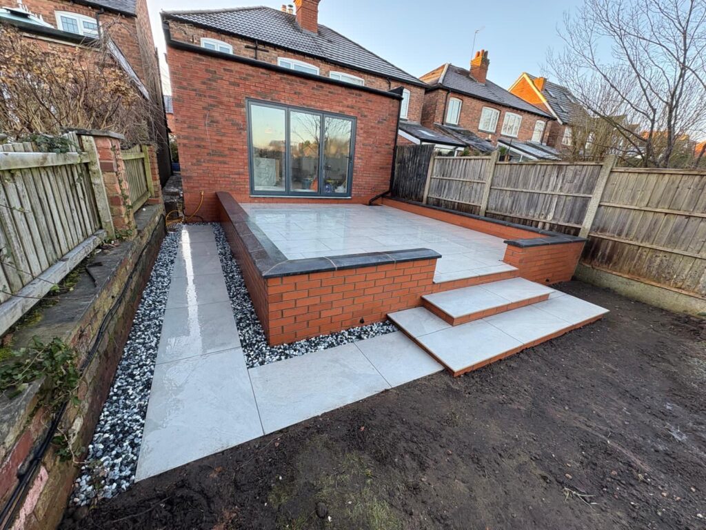porcelain patio and raised wall porcelain patio with raised retaining wall